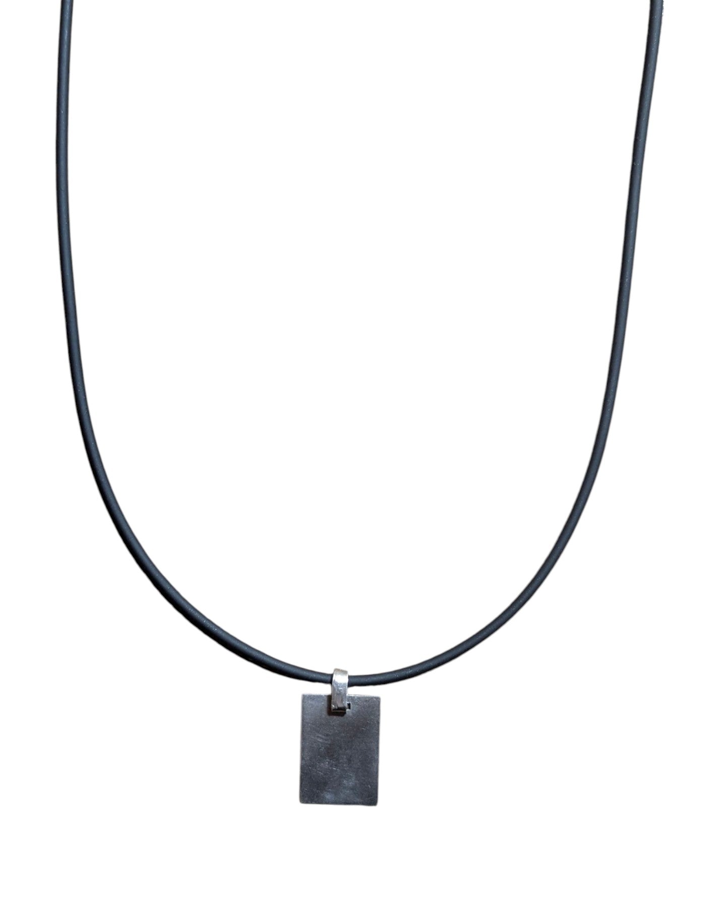 Minimalist silver-tone square pendant necklace on a long black rubber cord.
